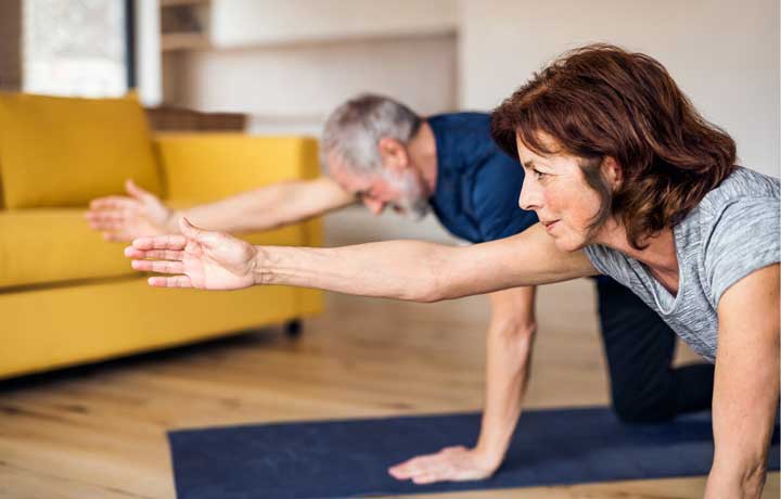 two seniors stretching